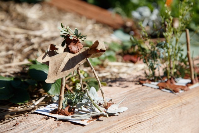 Small structure made from sticks, leaves, and clay created by students as homes for bugs