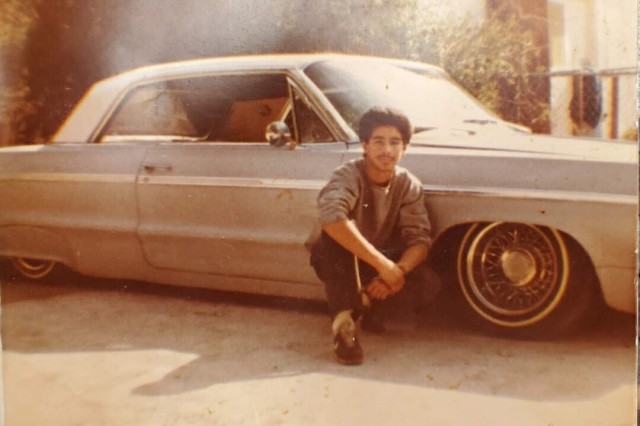 A young Raul Ramirez, Sandy's father, poses with his lowrider.