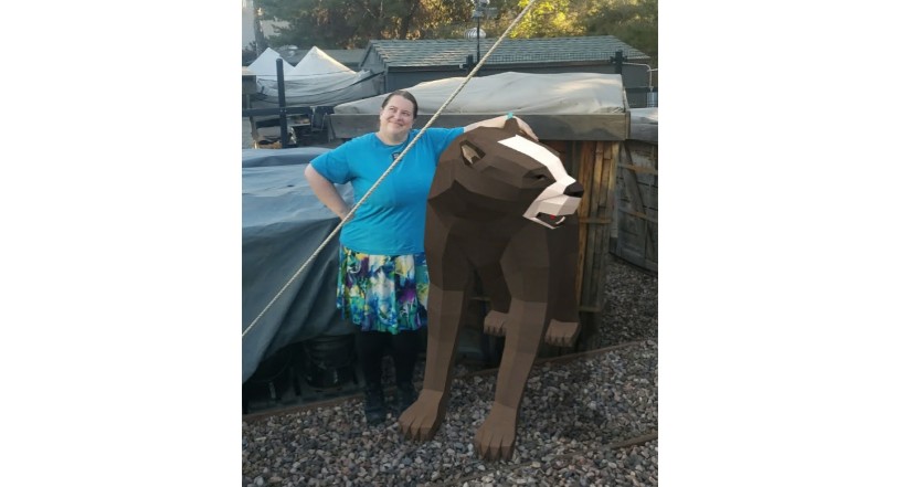 Preparator with digital Tar AR short-faced bear at Tar Pits