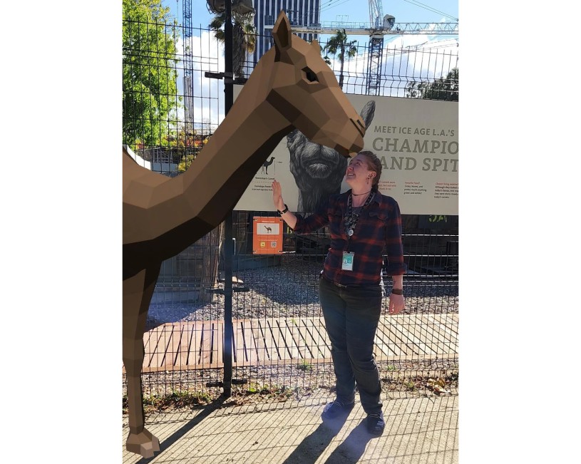 Digital Tar AR camel in front of sign at hancock park