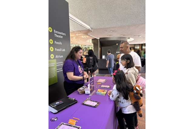 Staff and visitors on either side of a table