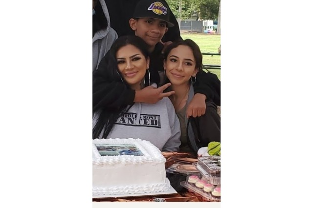 Sandy with her kids that love the lowrider culture.