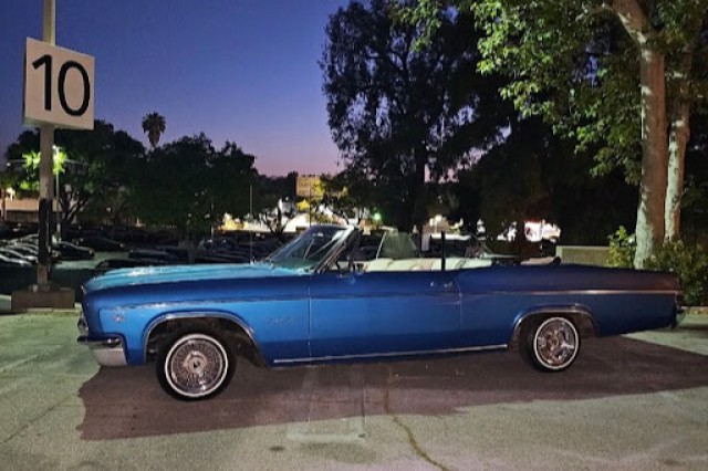 Sandy's dad's current blue lowrider
