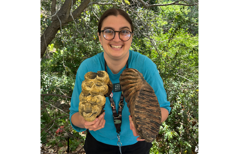La Brea Tar Pits Preparator Connie Clarke holding mastodon and mammoth teeth casts