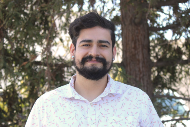 Giovanni Ugalde wearing a white and red patterned shirt