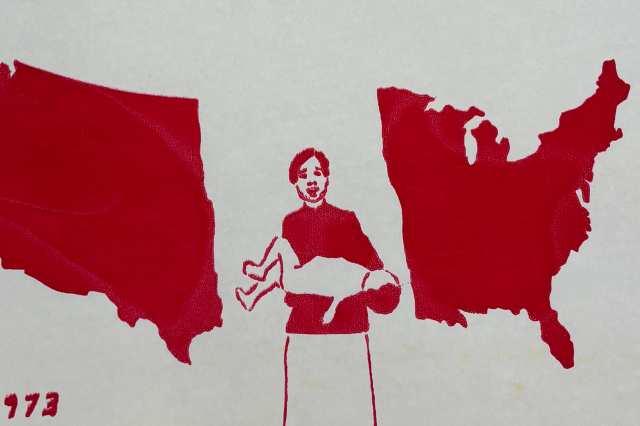A mother holds her dead child between the North American continent all depicted in red